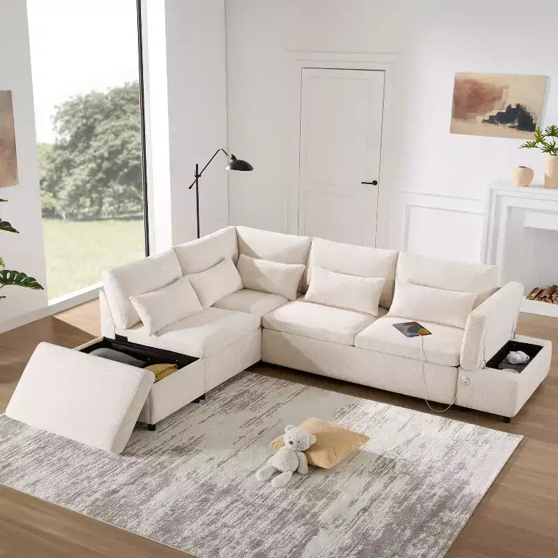 Divano sezionale estraibile a L beige/grigio con pouf contenitore e bracciolo di ricarica, 6 posti